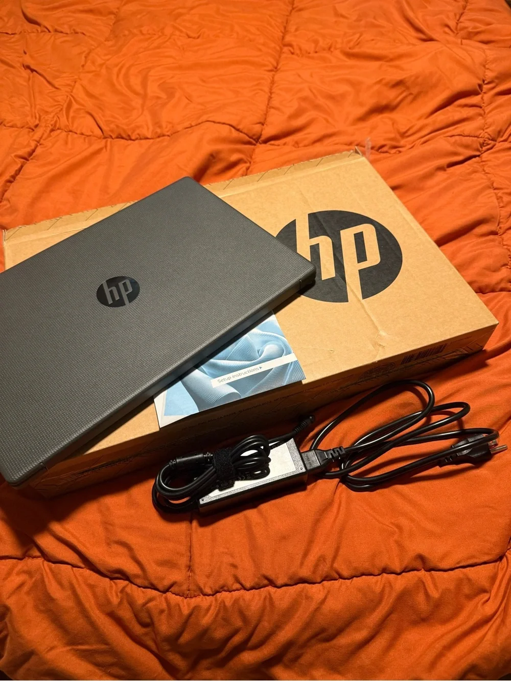 HP Laptop in Dark Gray with Charger and Setup Guide